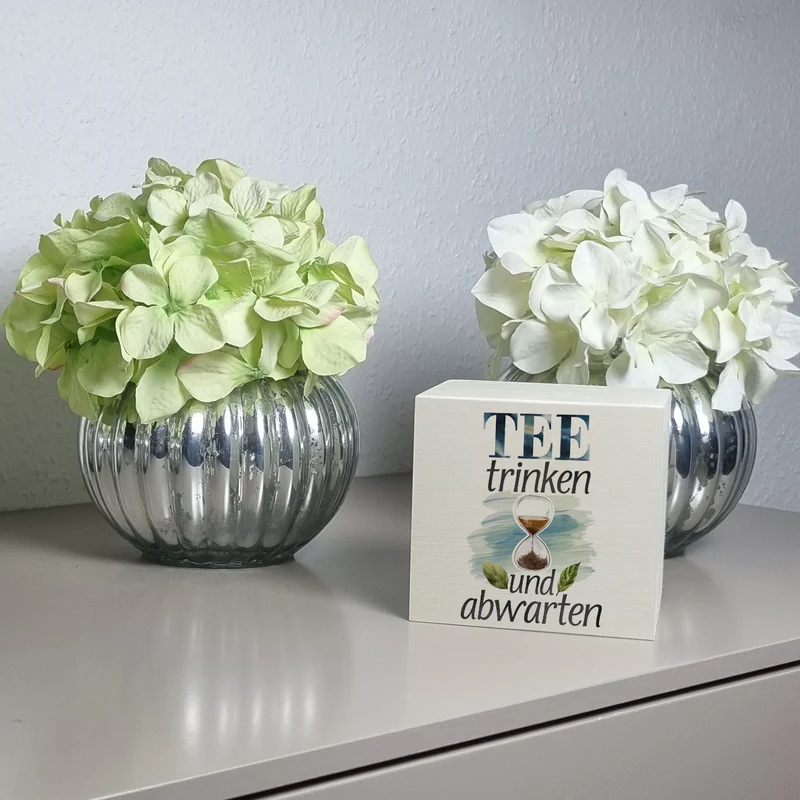 Sanduhr mit Teeblättern Spardose Tee trinken und abwarten