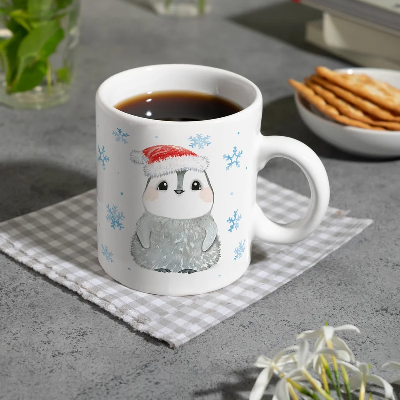 Pinguin mit Weihnachtsmütze Kaffeebecher