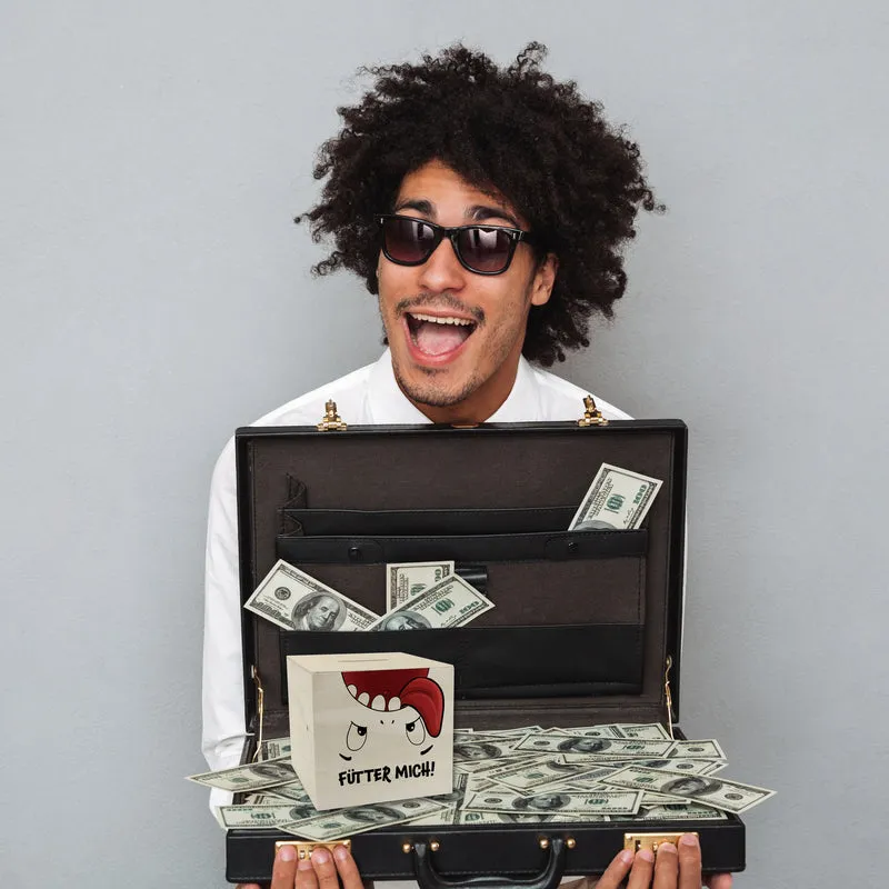 Spardose mit Comicfigur und lustigem Spruch - Fütter mich!